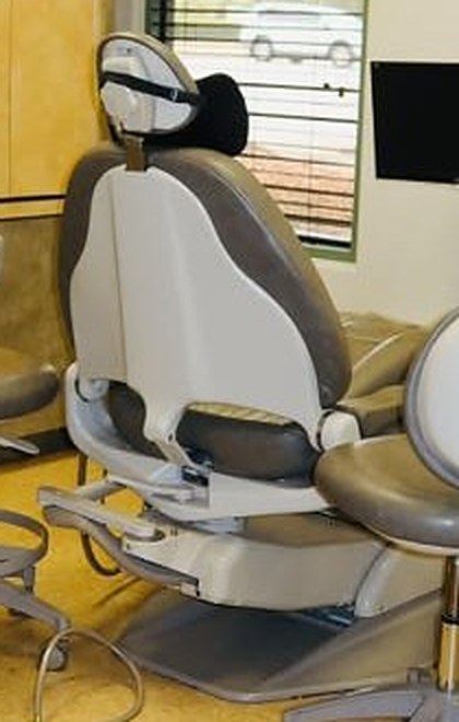 Dental chair in a treatment room at Oak & Ivory Dental in Round Rock, TX